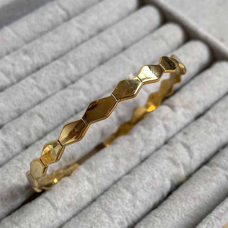 Gold-polished Beehive Bangle by Collection de Euphoria