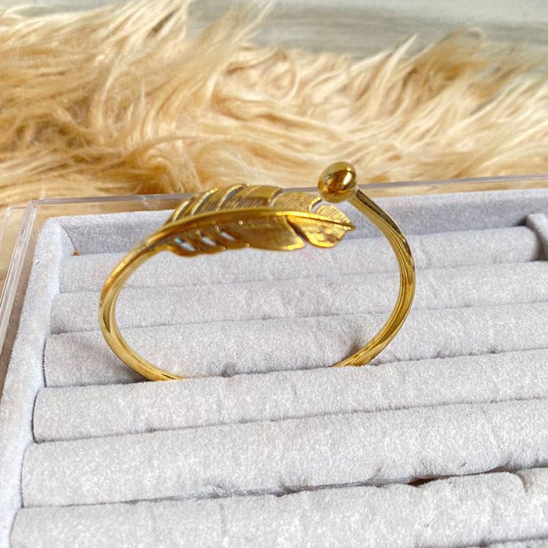 Gold-polished Feather Bangle by Collection de Euphoria