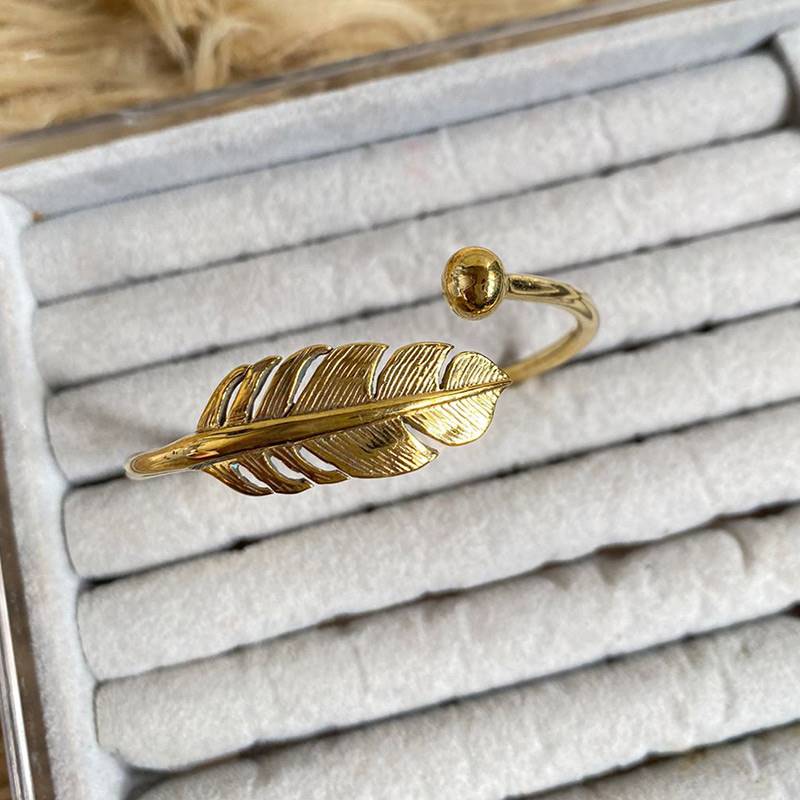 Gold-polished Feather Bangle by Collection de Euphoria