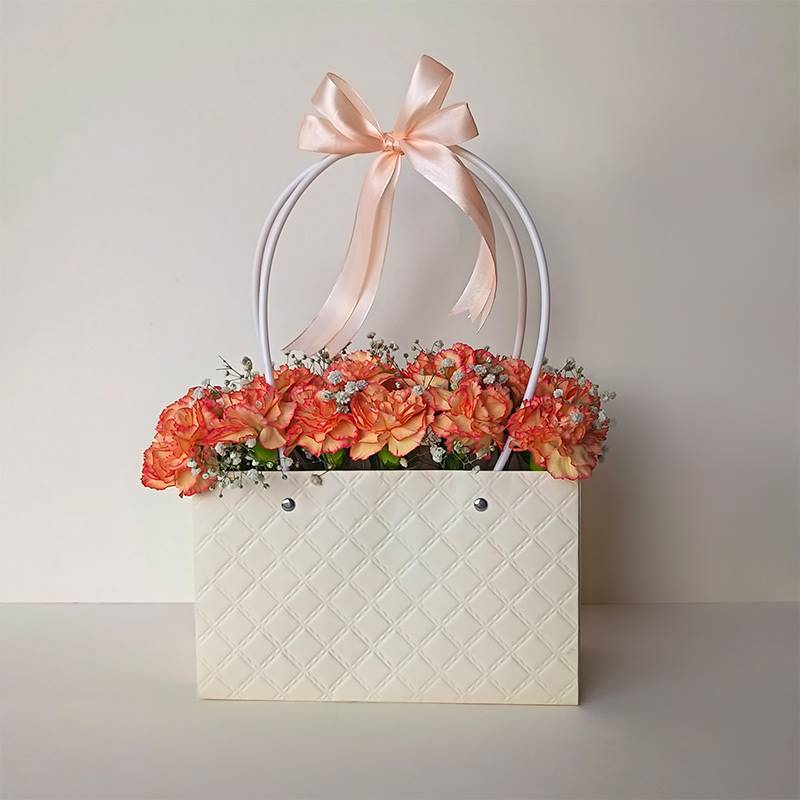 Fiery Orange Carnations in Paper Tote