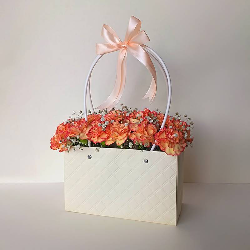 Fiery Orange Carnations in Paper Tote