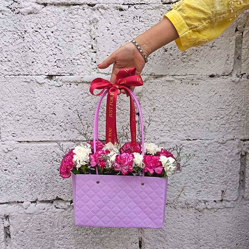 White & Fireberry Pink Carnations in Paper Tote