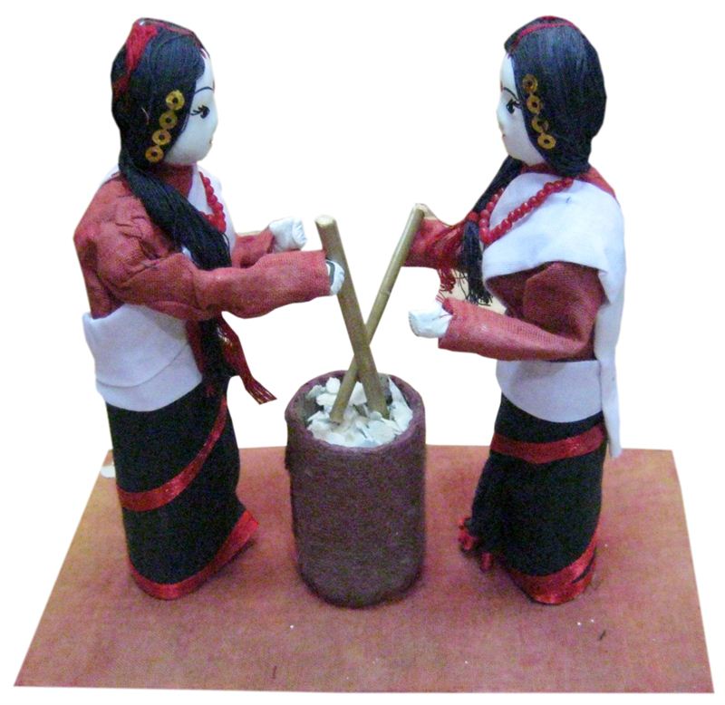 Two Newari Girl making Beaten Rice