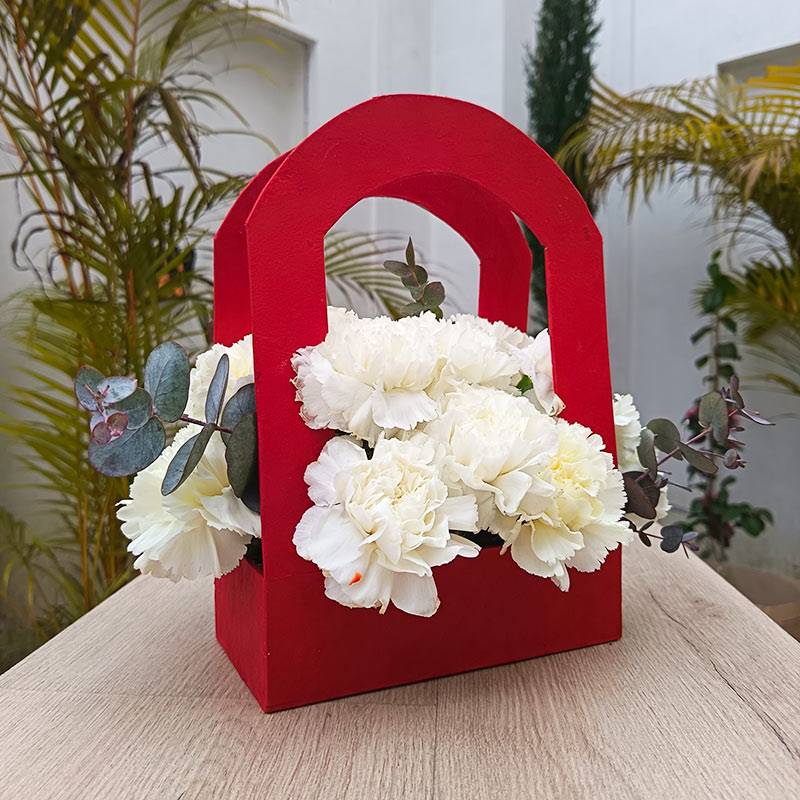 White Carnations in Arch Lokta Basket