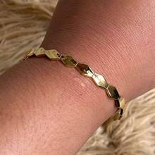 Gold-polished Beehive Bangle by Collection de Euphoria
