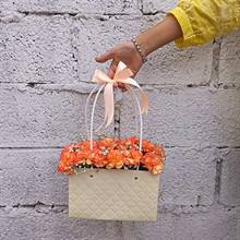 Fiery Orange Carnations in Paper Tote