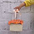 Fiery Orange Carnations in Paper Tote