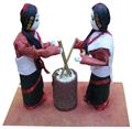Two Newari Girl making Beaten Rice